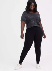 Model wearing Torrid Plus Size Full-Length Slim Fix Pocket Legging