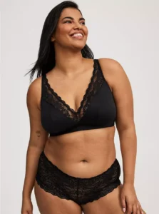 Plus size model wearing Torrid lightly lined plunge bralette