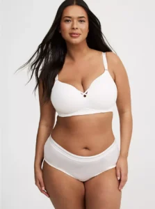 Model wearing Torrid Plus Size Dream Wire-Free Push-Up Bra in nude color