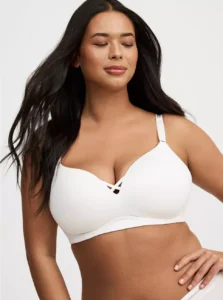 Model wearing Torrid Plus Size Dream Wire-Free Push-Up Bra in nude color