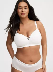 Model wearing Torrid Plus Size Dream Wire-Free Push-Up Bra in nude color