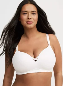 Model wearing Torrid Plus Size Dream Wire-Free Push-Up Bra in nude color