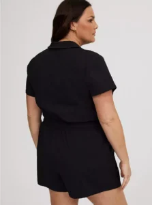 Plus size woman wearing Torrid Ripstop Romper with sneakers