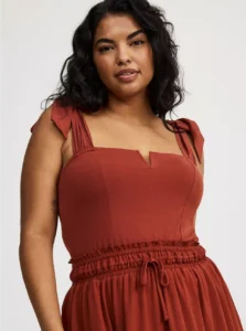 Model wearing Torrid Foxy Tie Strap Corset Tank in black